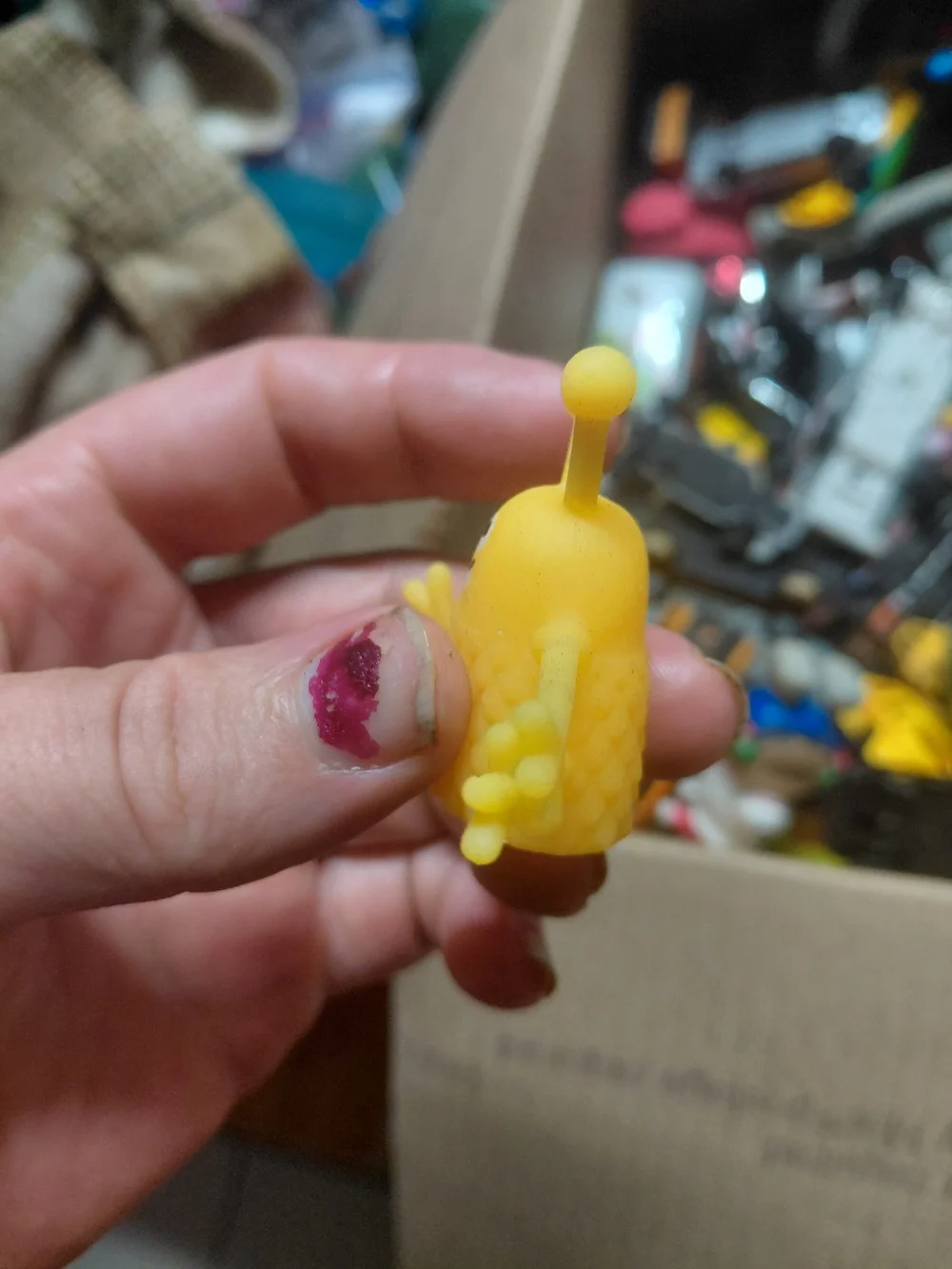 rubber alien monster finger puppet.